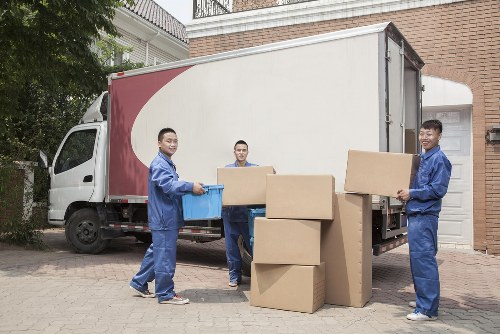 Trained movers using protective equipment during handling