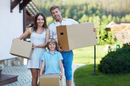Professional movers wrapping furniture for a Pentonville house move