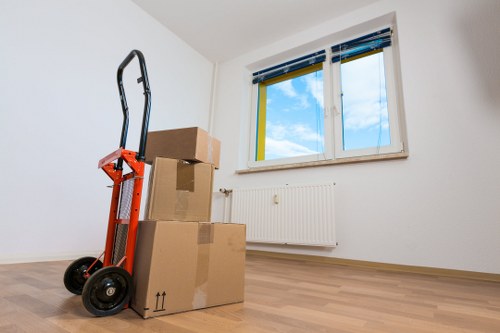Worker using safe lifting technique during a removal job